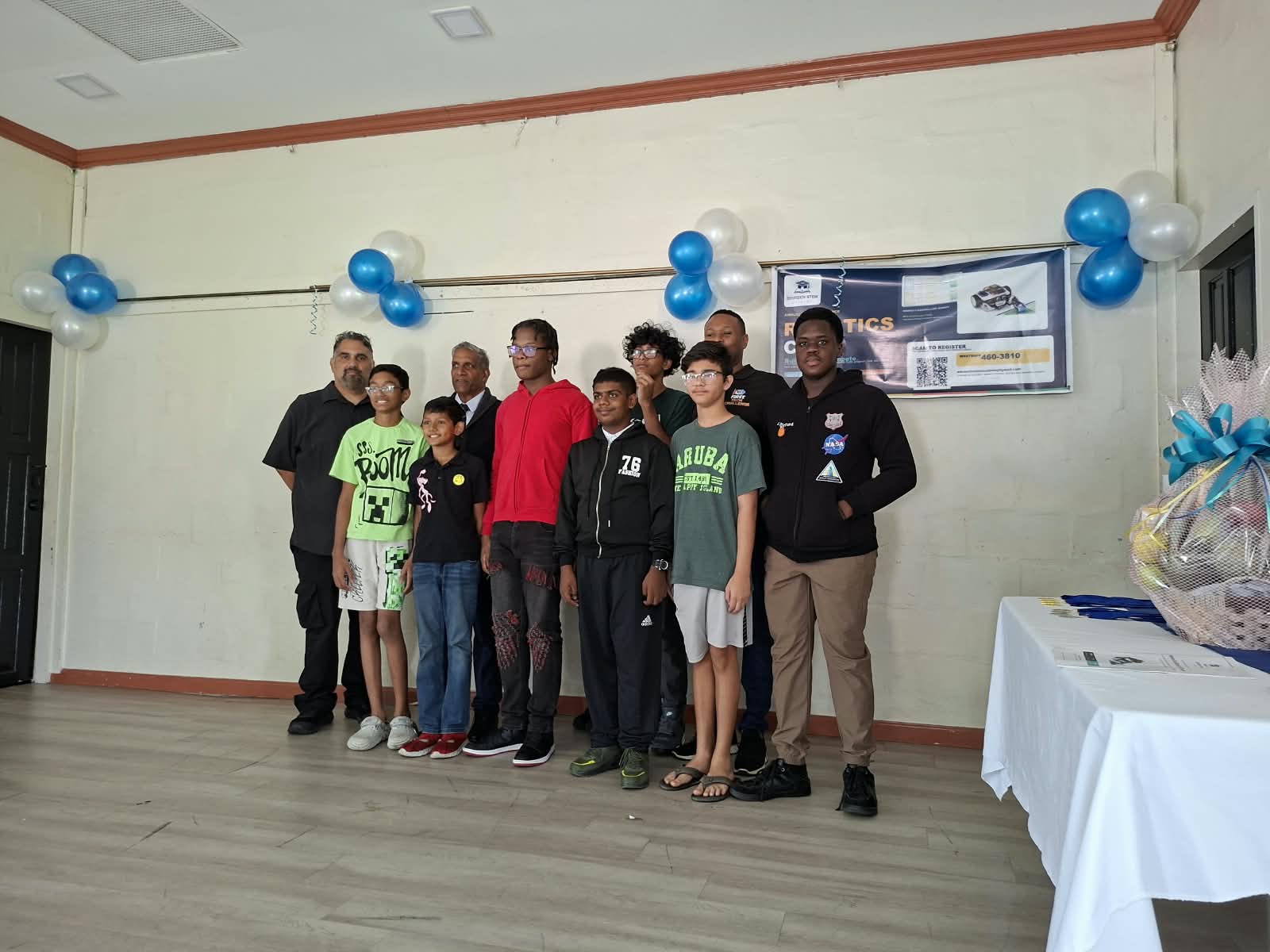 Robotics camp students, mentors, and guests celebrating together